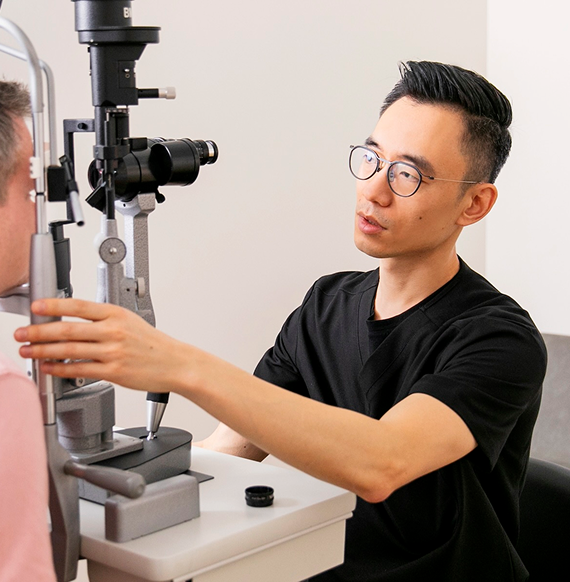 Dr. Kirk K. Hou examining a patient at Retina Vision Consultants