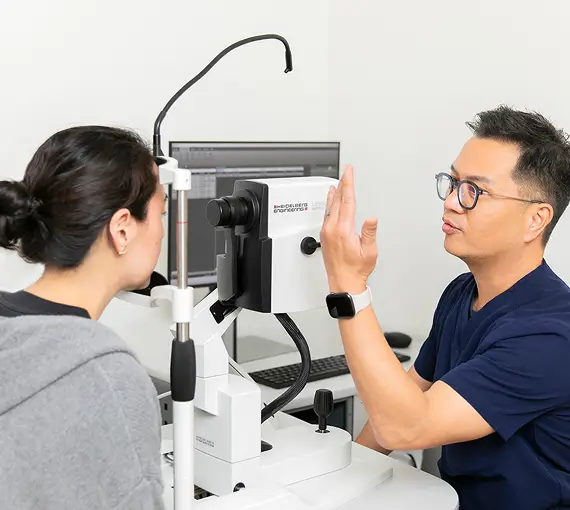 Robert Almanzor performing a diagnostic exam on a patient