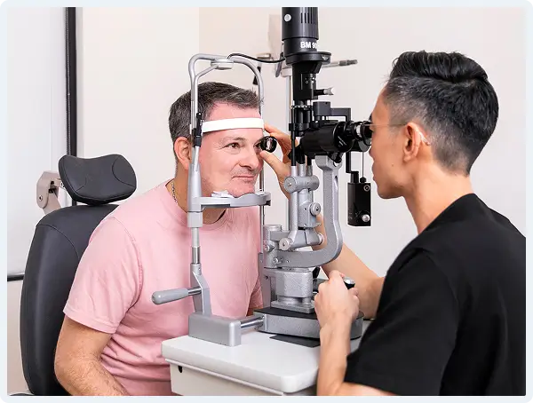 Dr. Kirk K. Hou examining a patient at Retina Vision Consultants