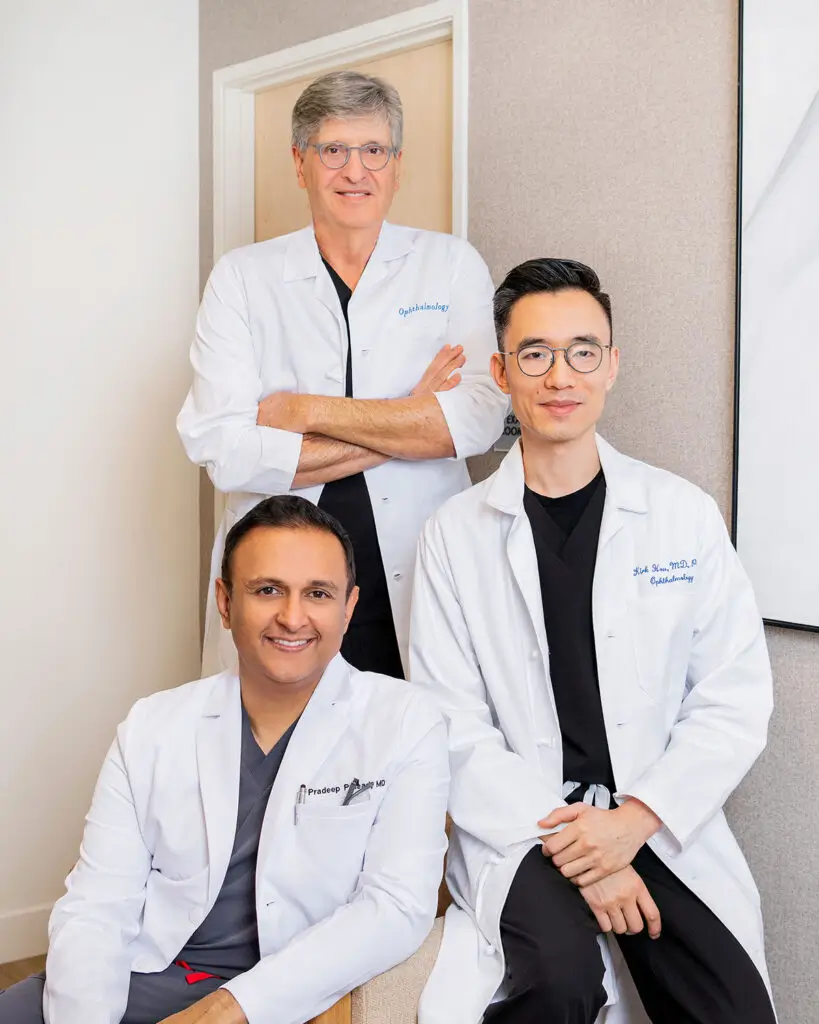 Drs. Kirk Hou, Pradeep Prasad, and Steven Schwartz, founding surgeons of Retina Vision Consultants, posing together for a portrait